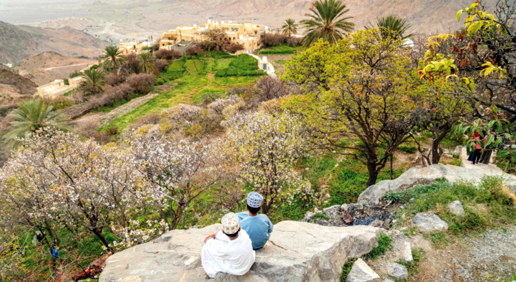 Boys looking onto the oasis of Wakan Ministry of Heritage Tourism Sultanate of Oman